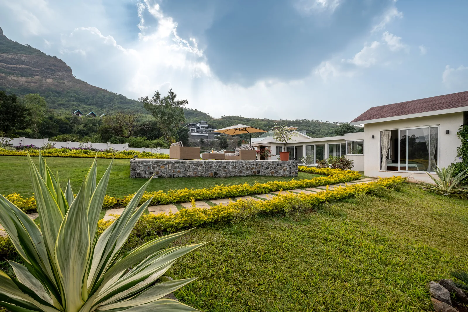 Front lawn and stone deck, Tikona fort behind